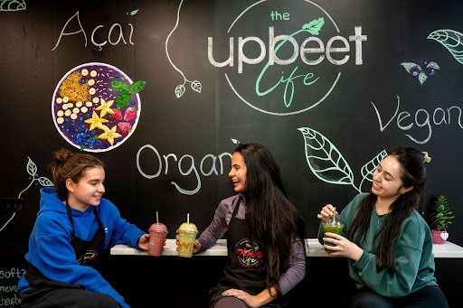 Women drinking smoothies.